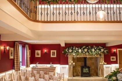 Hall and landing decorated with garlands of flowers and lanterns