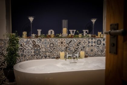 Bubble bath surrounded by candles