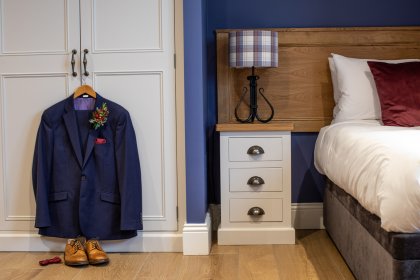 Suit on hanger in bedroom